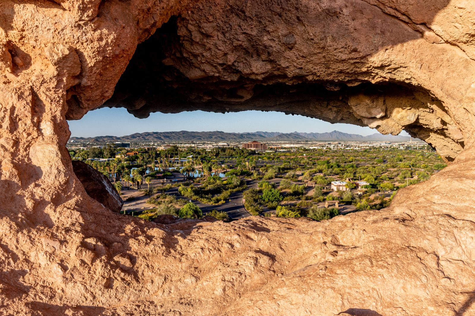 Phoenix skyline framed by desert rock